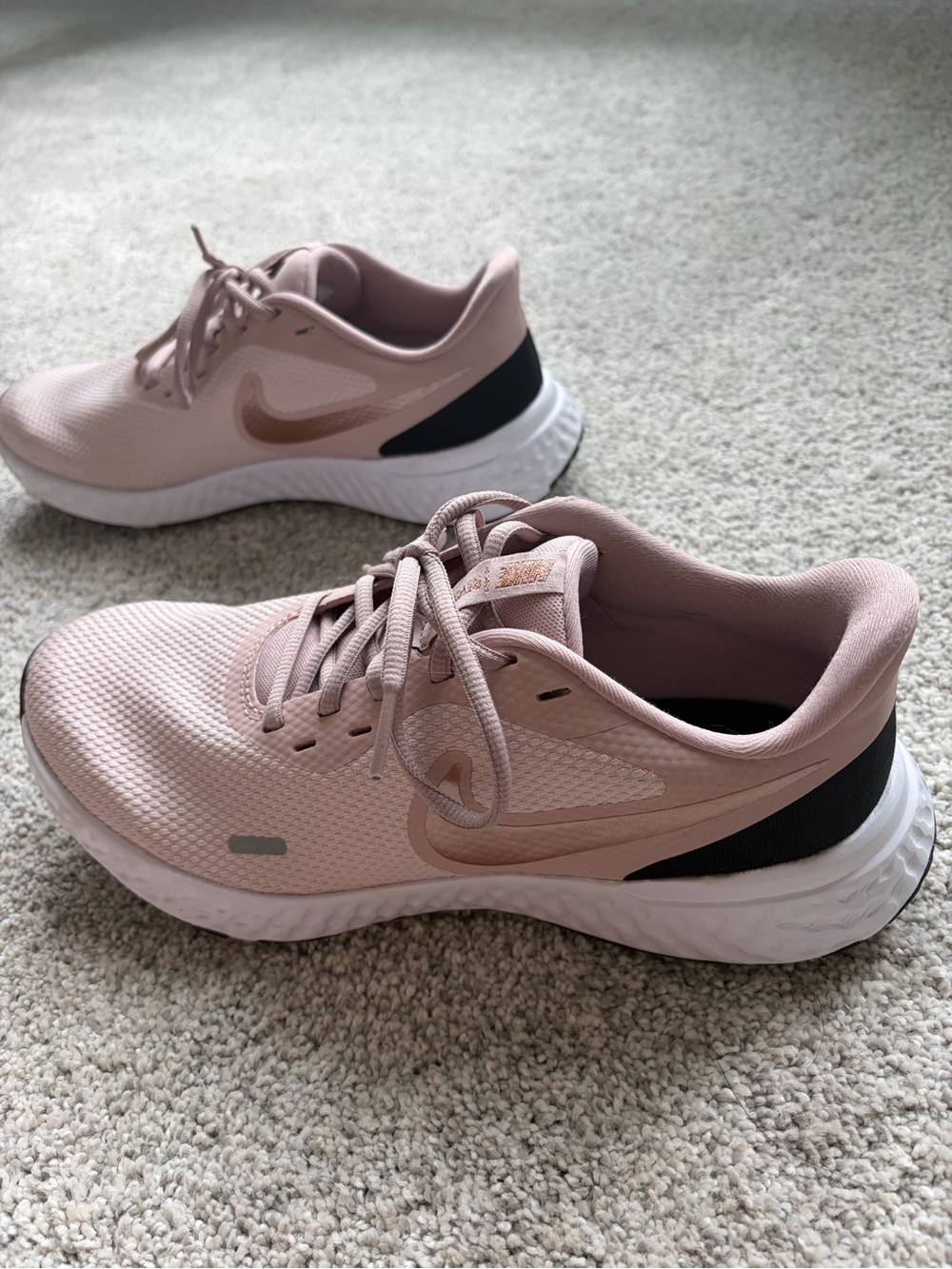 Nike Women's Blush Pink Athletic Running Shoes with Black Heel Accent